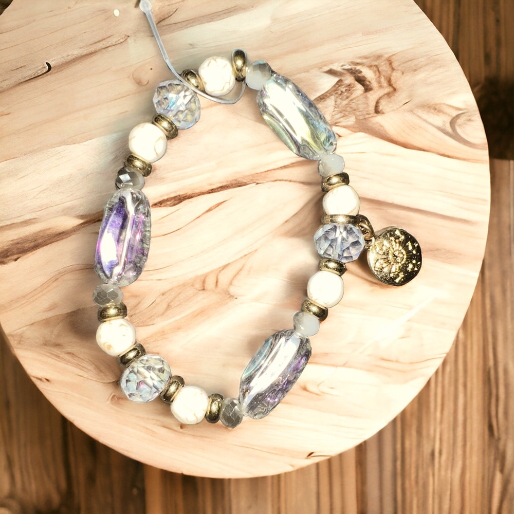 Clear, cream & gold beaded bracelet with small gold charm